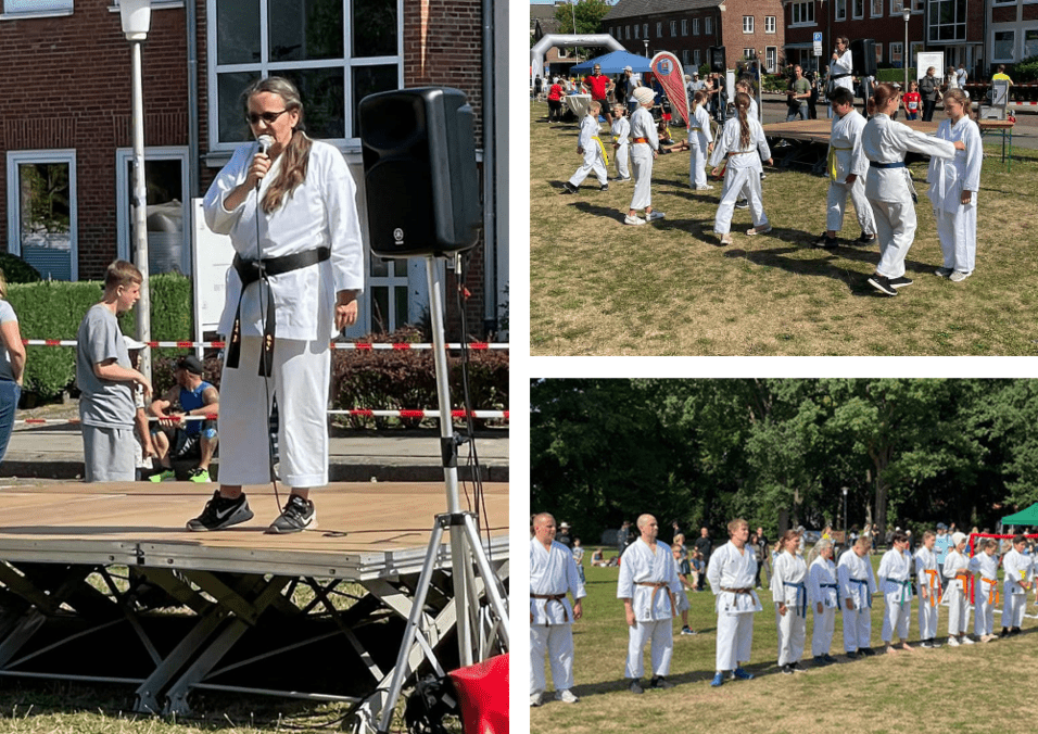 Auf einer Bühne spricht eine Frau in Karateanzug ins Mikrofon; im Hintergrund trainieren Kinder in Karateanzügen.